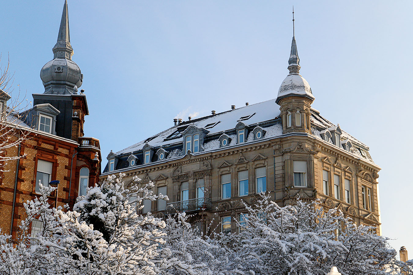 Snow-covered roofs of iconic buildings in the city of Sarreguemines. ©2021 Mathieu Improvisato